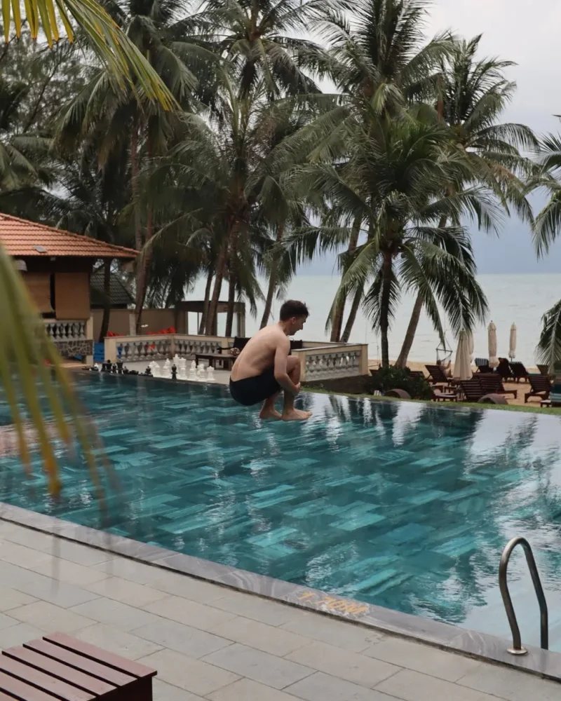 Jumping into a swimming pool at Ong Lang beach