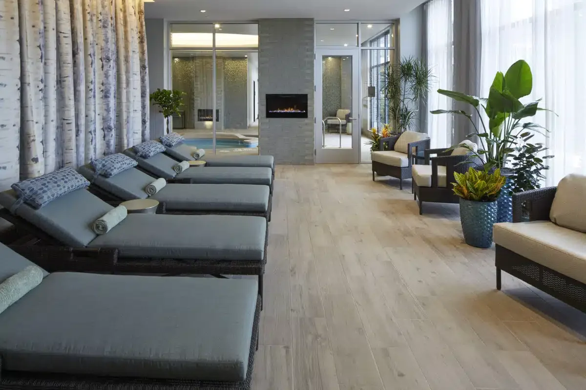 Kohler Waters relaxation lounge at Lodge Kohler with reclined chairs and plants.
