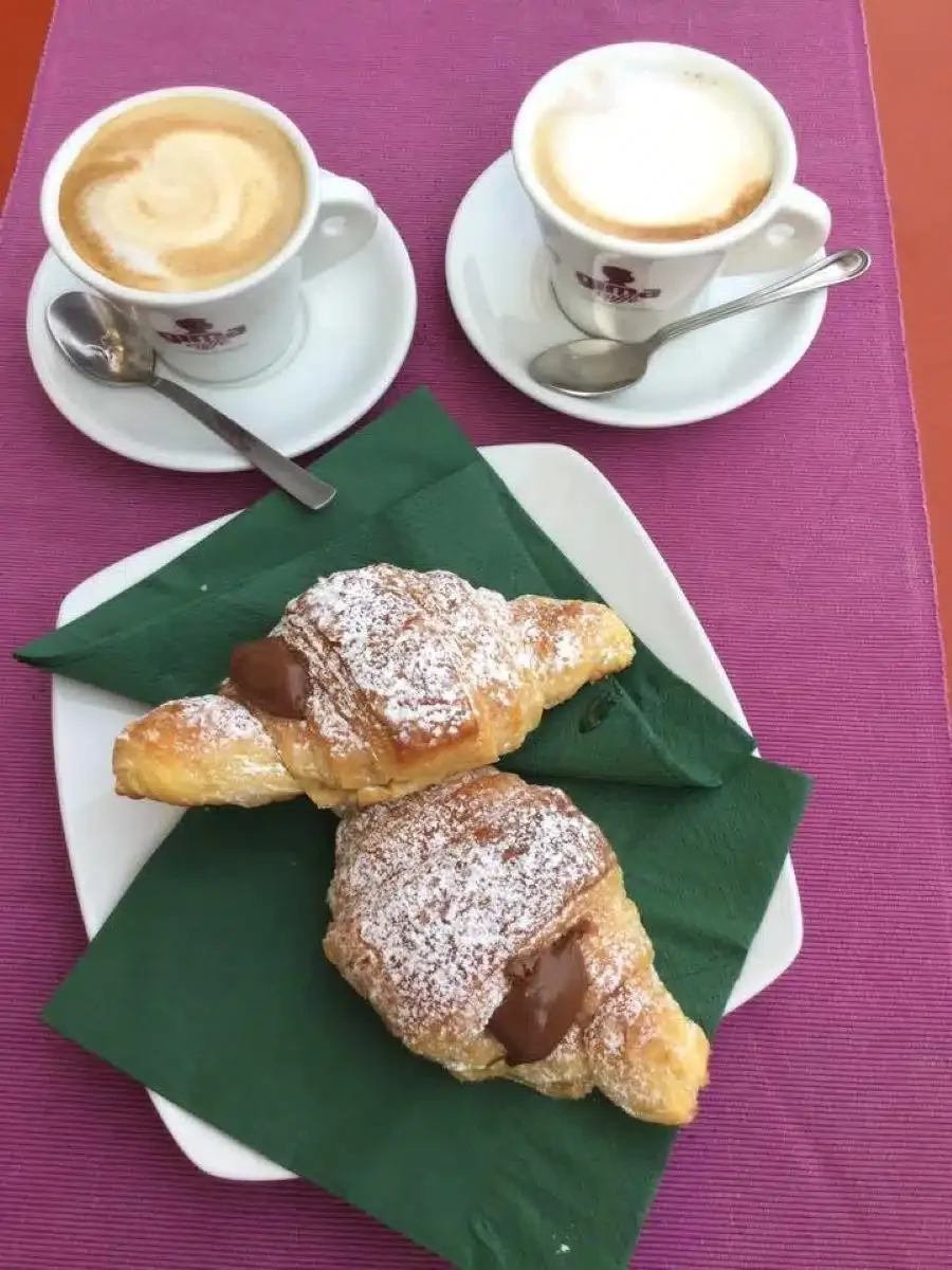 Coffee and croissants before cycling in Rome.