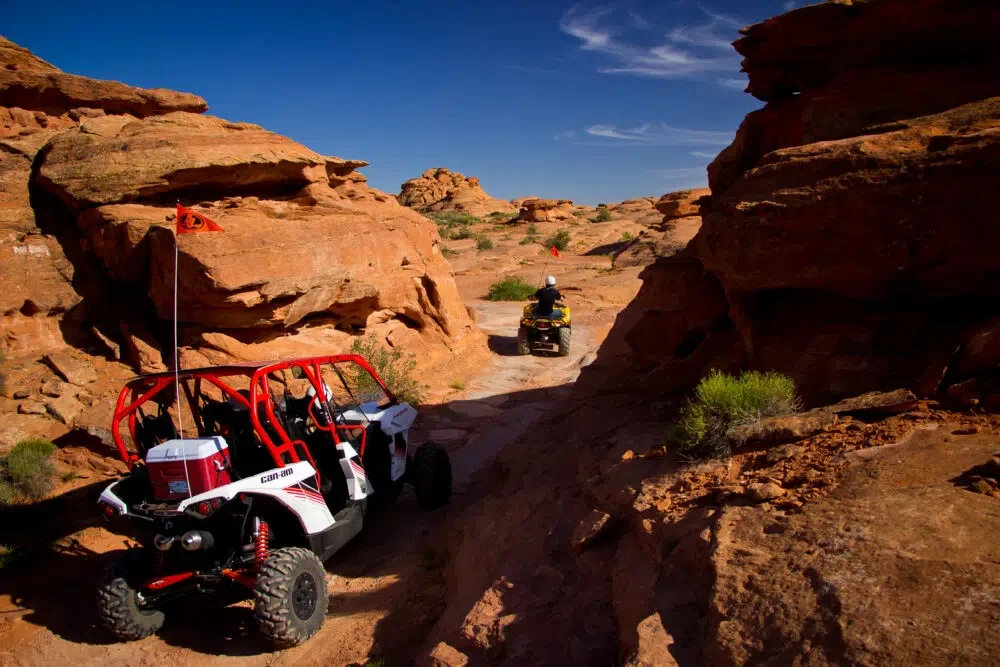 Off highway vehicles in a rocky canyon