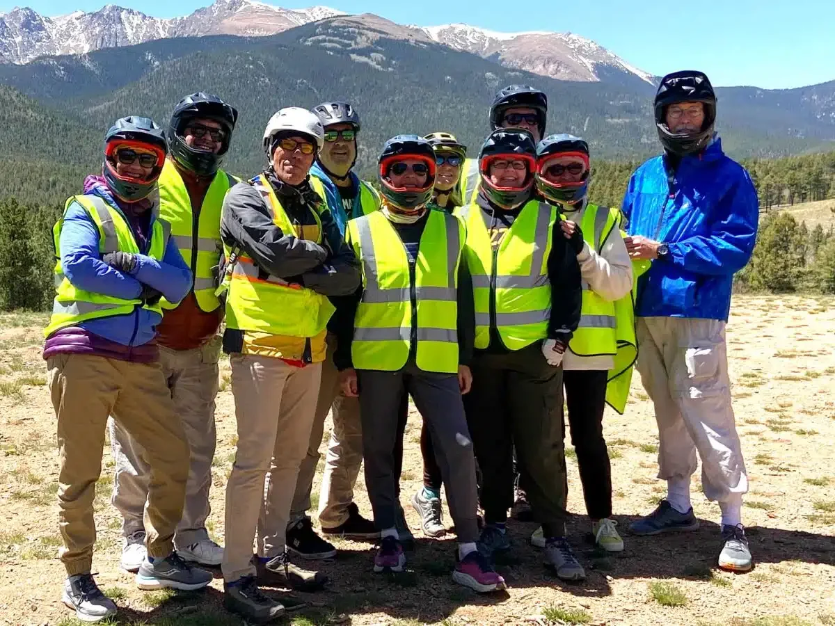 Group of riders pose for a photo.