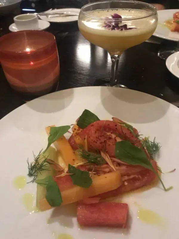 An heirloom tomato salad and a mocktail.