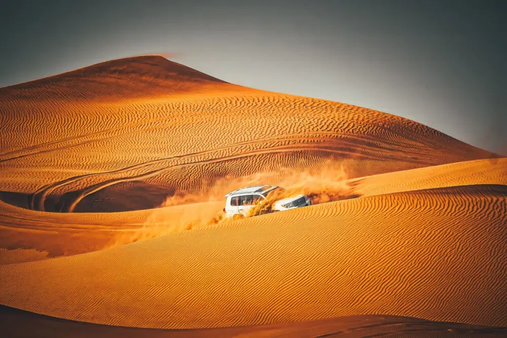 4x4 driving through sand dunes