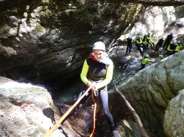 Brittney rappelling through the crevices.