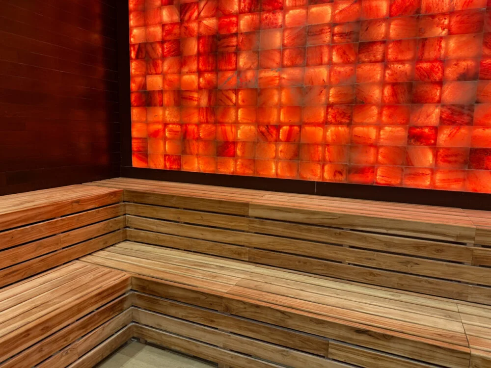 salt block glowing red with redwood benches under it