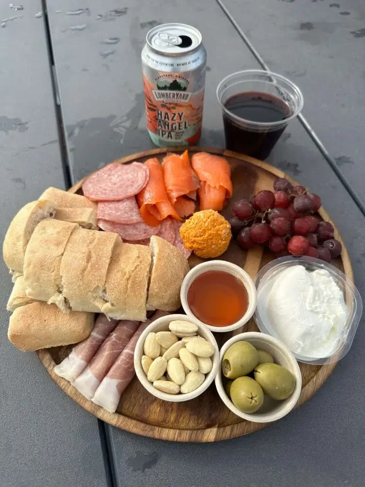 Under Canvas sells upscale food and drinks, including a charcuterie platter, craft beer, and boutique wine. Credit: Geri Koeppel